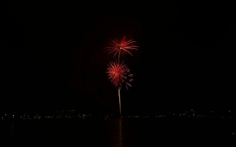 a fireworks is lit up in the night sky