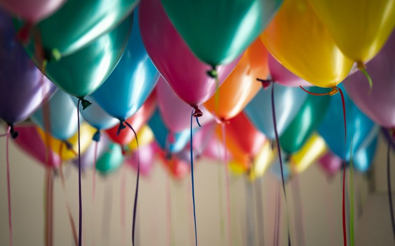 selective focus photography of assorted-color balloons